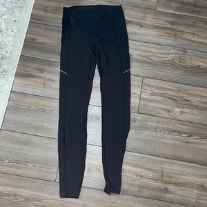 black lululemon leggings with pockets and reflective details!